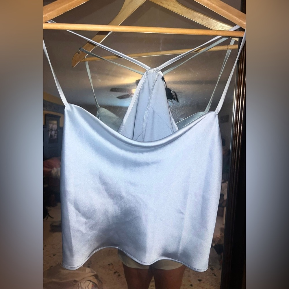 Forever 21 size small silvery blue silky tank. Slouchy neck style. Never worn.